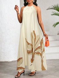 Vestido Longo Estampado Bege com Gola Halter – Elegância e Fluidez do P ao GG