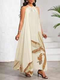 Vestido Longo Estampado Bege com Gola Halter – Elegância e Fluidez do P ao GG